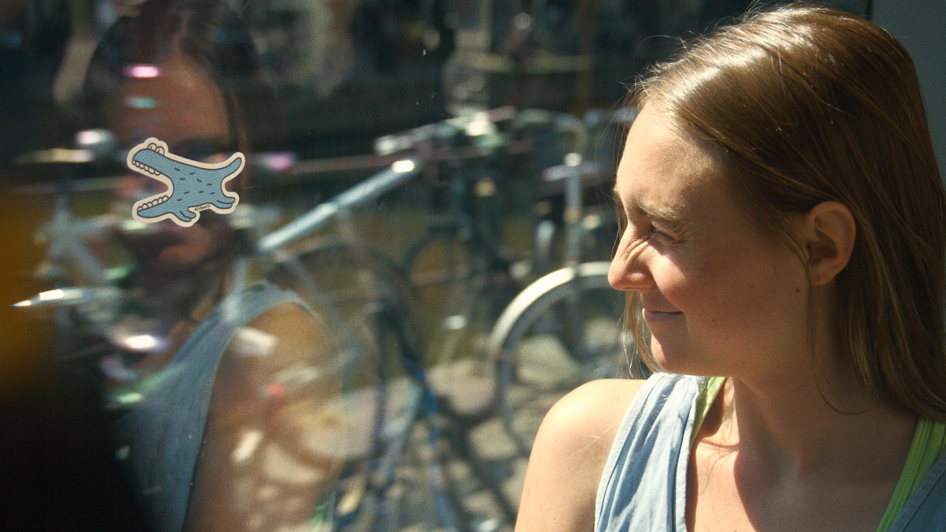 A woman playing GVBeestje in the tram